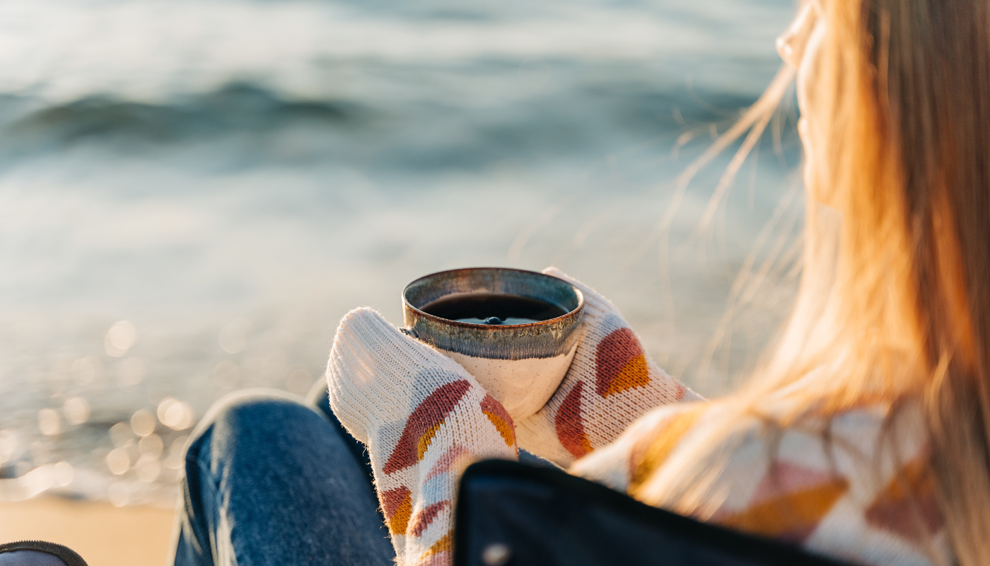 girl having coffee at the beach on st simons island