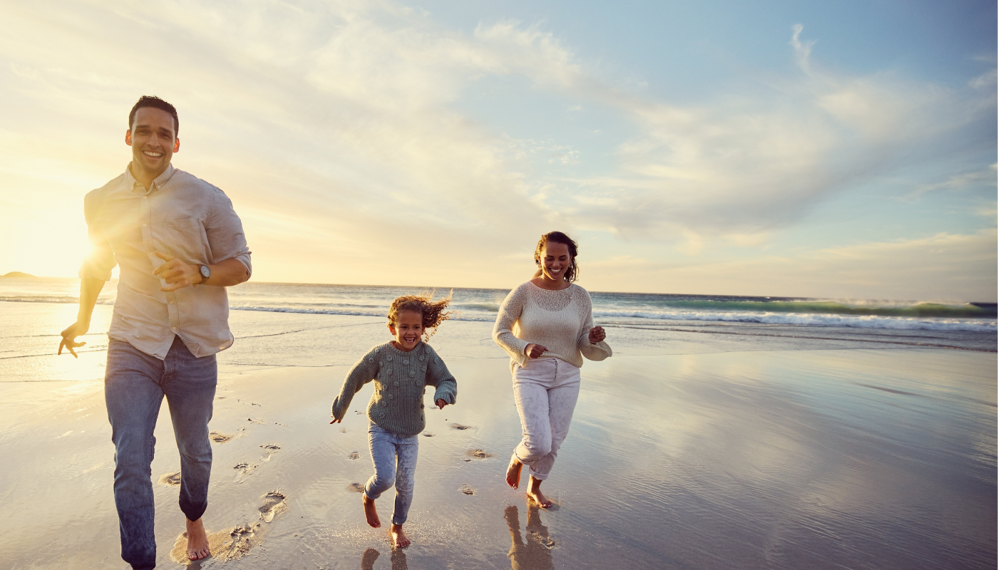 family running on st simons beach in winter